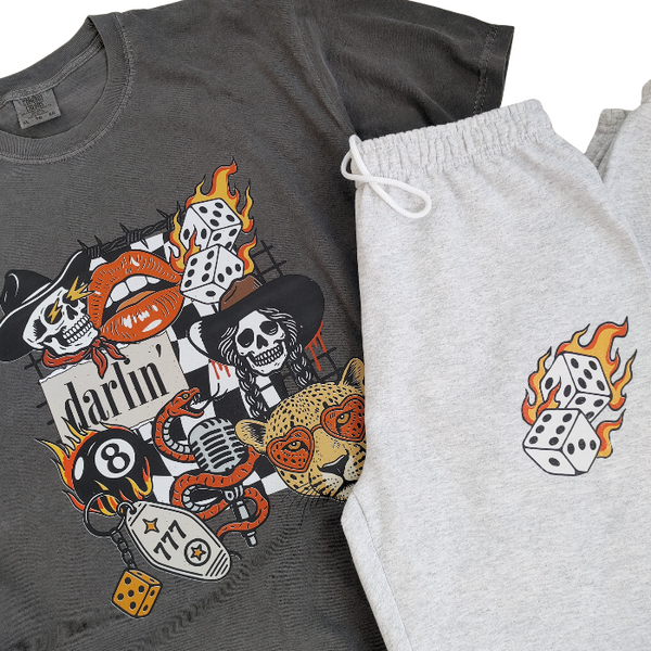 This Western tattoo–inspired graphic tee brings bold retro vibes with cowboy skulls, flaming dice, vintage lips, a heart-eyed leopard, and more. Large graphic print on a soft 100% comfy cotton Comfort Colors t-shirt, it delivers that perfectly broken-in feel from the first wear. 