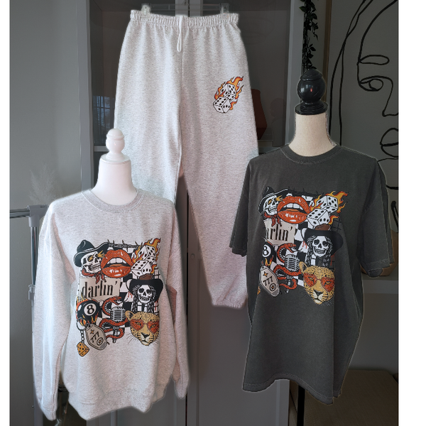 Bring bold retro energy to your wardrobe with this 3-piece vintage Western tattoo graphic set, including a cozy sweatshirt, Comfort Colors tee, and matching flame-dice sweatpants.