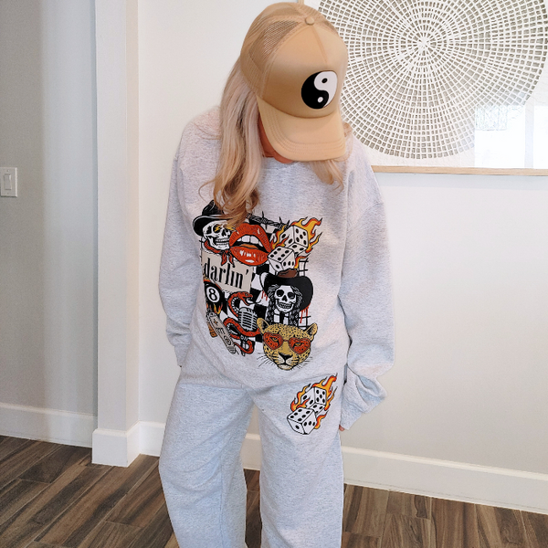 Bring bold retro energy to your wardrobe with this 3-piece vintage Western tattoo graphic set, including a cozy sweatshirt, Comfort Colors tee, and matching flame-dice sweatpants.