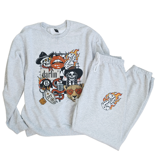 These Western tattoo-inspired sweatpants feature a bold flaming dice graphic on soft, cozy fleece—perfect for anyone who loves unique, edgy loungewear. Made with 50% cotton / 50% polyester, these unisex joggers have a naturally oversized fit for extra comfort. Designed with a drawstring elastic waistband, elastic cuffs, and no pockets for a clean, streamlined look. 