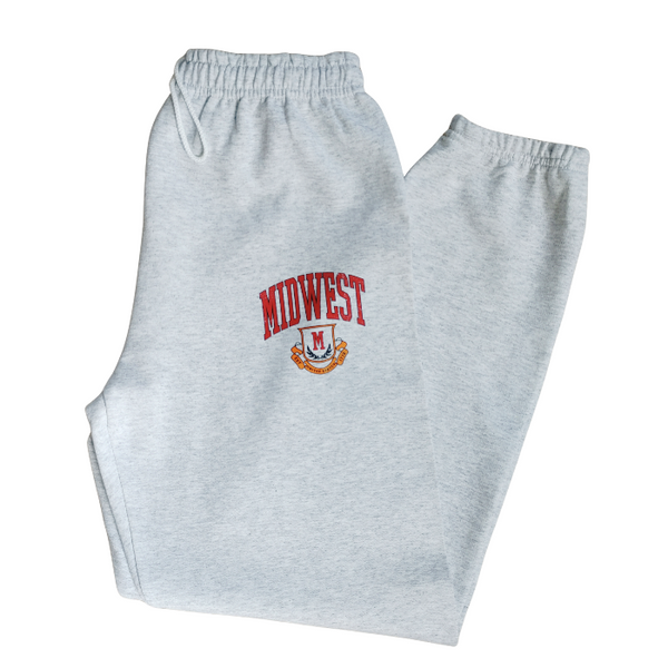 These Midwest Logo Sweatpants are the ultimate blend of comfort and casual oversized relaxed fit for a trendy streetwear look. Featuring a distressed varsity-inspired graphic that matches the sweatshirt and t-shirt in the collection, these ash gray joggers have a drawstring elastic waistband for adjustable comfort & are perfect for lounging, travel, errands, or creating a coordinated Midwest set look.