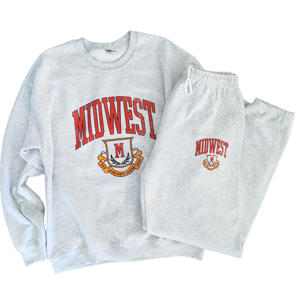 This Midwest Sweatshirt and Sweatpants Set combines cozy comfort with classic collegiate style. Featuring a distressed varsity-inspired Midwest graphic on a matching ash gray crewneck and jogger set, this outfit is perfect for travel days, casual weekends, running errands, or relaxing in ultimate comfort. Sweatpants feature a relaxed oversized fit, and for an oversized fit size up in our crewneck. Matching Midwest graphic t-shirt sold separately.
