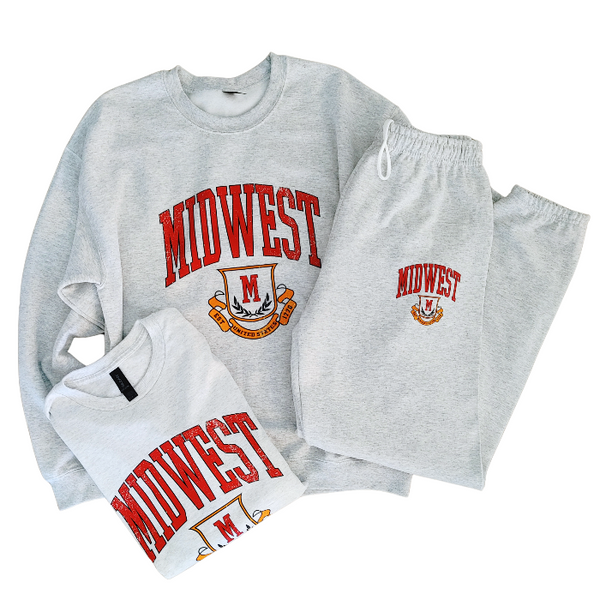 This Midwest Sweatshirt is the perfect blend of cozy comfort and classic collegiate style. Featuring a distressed varsity-inspired graphic on a soft ash gray crewneck, this unisex sweatshirt delivers an effortless retro look that's perfect for everyday wear, game days, travel, or lounging in comfort. Size up for an oversized sweatshirt look.