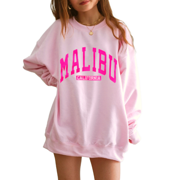 Our super soft pink Malibu crewneck is a great stylish and trendy piece. The Malibu California sweatshirt is perfect for layering or wearing alone for a casual look. With neon pink lettering, this sweatshirt is preppy in style and also makes the perfect gift! Don't forget to size up for an oversized trendy look.